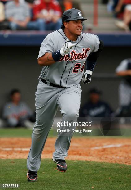 First baseman Miguel Cabrera of the Detroit Tigers follows his run scoring double against the Washington Nationals at Space Coast Stadium on March 9,...
