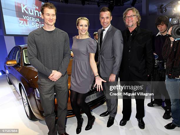 Jens Lehmann, Verena Kerth, Kai Pflaume and Martin Krug pose in front of the Audi A 8 during the presentation of the new Audi A8 car on March 9, 2010...