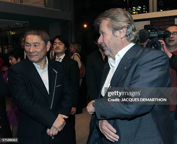 Former French president of Cartier at the "Fondation Cartier" art fondation Alain-Dominique Perrin arrives for a visit of Japanese film director and...
