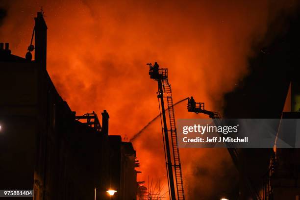 Fire fighters battle a blaze at the Mackintosh Building at the Glasgow School of Art for the second time in four years on June 16, 2018 in Glasgow,...