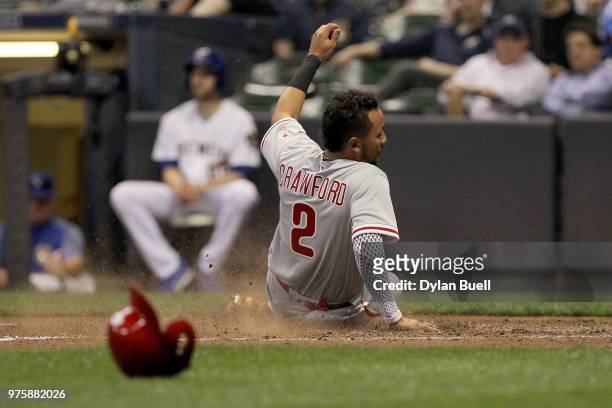 Crawford of the Philadelphia Phillies slides into home plate to score a run in the sixth inning against the Milwaukee Brewers at Miller Park on June...