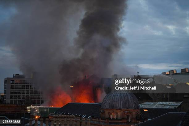 Fire fighters battle a blaze at the Mackintosh Building at the Glasgow School of Art for the second time in four years on June 16, 2018 in Glasgow,...