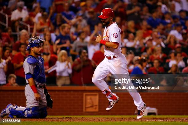 Matt Carpenter of the St. Louis Cardinals crosses home plate after hitting a home run against the Chicago Cubs in the sixth inning at Busch Stadium...