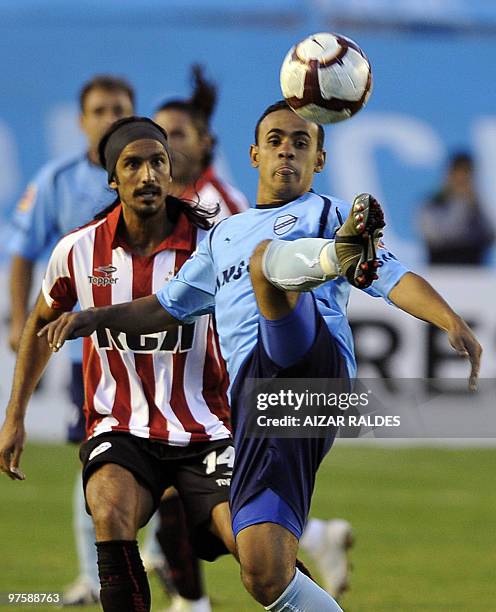 Marcos Angeleri of Argentinian Estudiantes vies for the ball with Charles Da Silva of Bolivian Bolivar during their Libertadores Cup football match,...