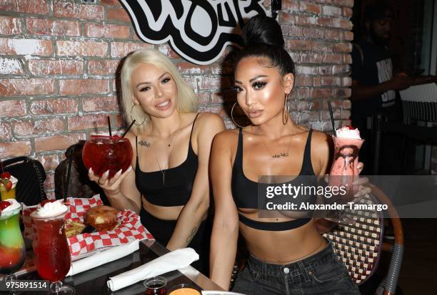 Krissy Turpin and Angie Ang are seen at the grand opening of Wild 'N Out Sports Bar & Arcade on June 15, 2018 in Miami Beach, Florida.