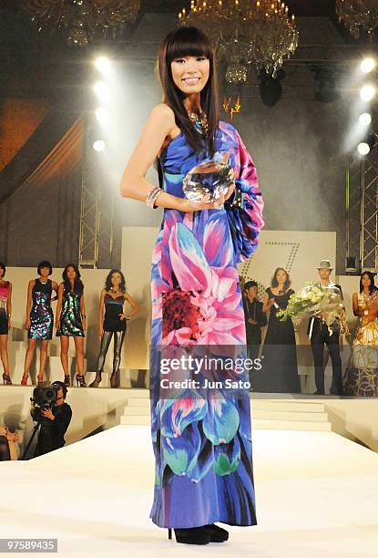 Newly crowned 2010 Miss Universe Japan Maiko Itai poses for photographers during the 2010 Miss Universe Japan final competition at Grand Prince Hotel...