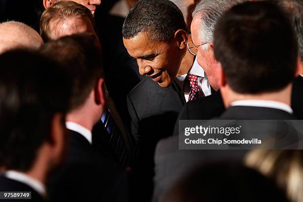 President Barack Obama smiles as he greets guests during an event marking Greek Independence Day in the East Room of the White House March 9, 2010 in...