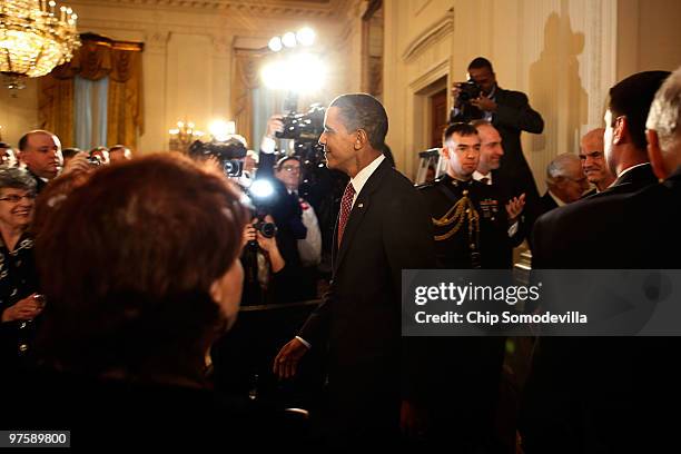 President Barack Obama arrives in the East Room for an event marking Greek Independence Day at the White House March 9, 2010 in Washington, DC. Obama...