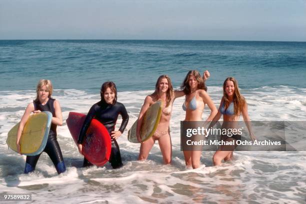 Rock band 'The Runaways' pose for a portrait on the beach in April, 1976 in Los Angeles, California. Cherie Currie, Joan Jett, Sandy West, Jackie Fox...