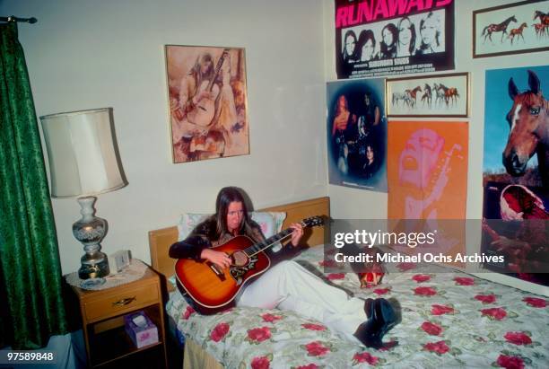 Guitarist Lita Ford of the rock band 'The Runaways' poses for a portrait in her bedroom at her family's home in November 1976 in Los Angeles,...