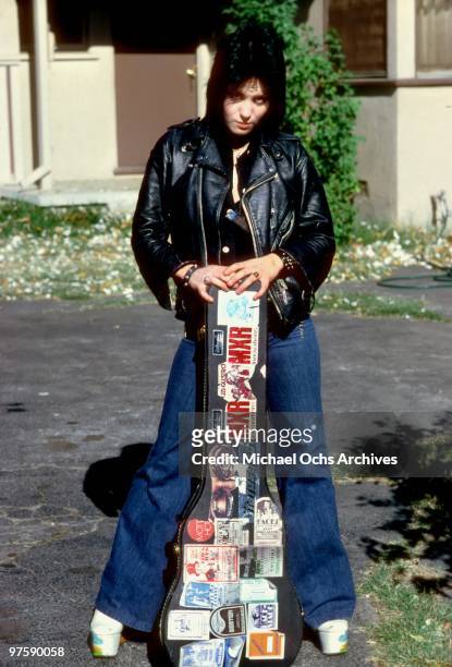 Guitarist Joan Jett of the rock band "The Runaways" poses for a portrait by her family's home in Canoga Park just outside Los Angeles, CA in 1977.