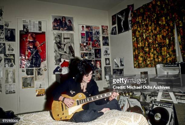 Guitarist Joan Jett of the rock band "The Runaways" poses for a portrait in her bedroom at her family's home in Canoga Park just outside Los Angeles,...