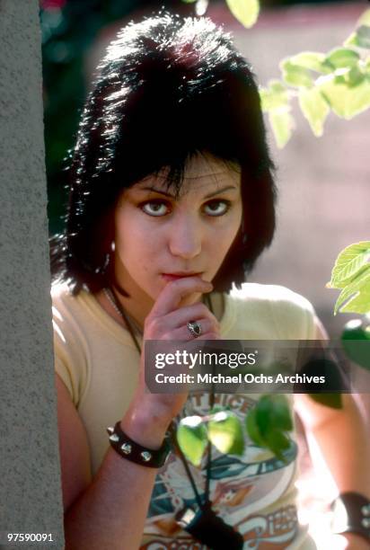 Guitarist Joan Jett of the rock band "The Runaways" poses for a portrait by her family's home in Canoga Park just outside Los Angeles, CA in 1977.