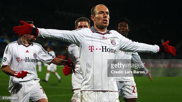 Arjen Robben of Muenchen celebrates after scoring his teams second goal during the UEFA Champions League round of sixteen, second leg match between...
