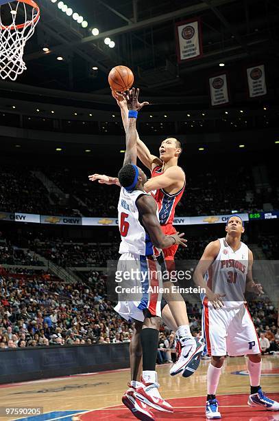 Yi Jianlian of the New Jersey Nets shoots against Ben Wallace of the Detroit Pistons during the game at the Palace of Auburn Hills on February 6,...