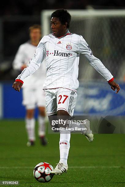 David Alaba of Muenchen runs with the ball during the UEFA Champions League round of sixteen, second leg match between AFC Fiorentina and FC Bayern...