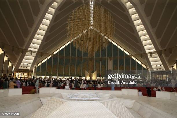 Senegalese muslims gather to perform Eid al-Fitr prayer at the Faisal Mosque at the end of Ramadan in Islamabad, Pakistan on June 16, 2018.