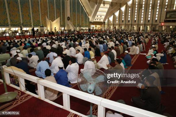 Senegalese muslims gather to perform Eid al-Fitr prayer at the Faisal Mosque at the end of Ramadan in Islamabad, Pakistan on June 16, 2018.