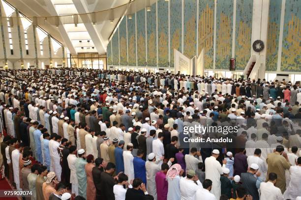 Senegalese muslims gather to perform Eid al-Fitr prayer at the Faisal Mosque at the end of Ramadan in Islamabad, Pakistan on June 16, 2018.