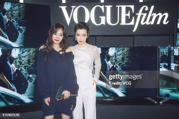 Actress Yang Mi and actress Li Bingbing pose on the red carpet of 2018 Vogue Film Gala on June 15, 2018 in Shanghai, China.