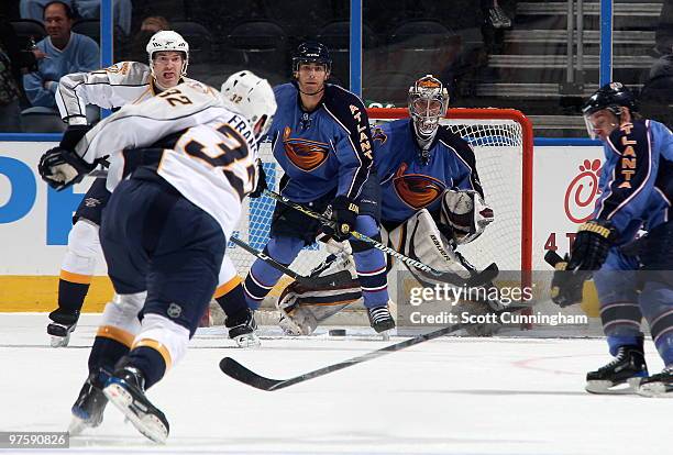 Cody Franson of the Nashville Predators fires a shot against Johan Hedberg of the Atlanta Thrashers at Philips Arena on March 9, 2010 in Atlanta,...