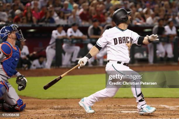 Daniel Descalso of the Arizona Diamondbacks hits a sacrifice fly against the New York Mets during the third inning of the MLB game at Chase Field on...