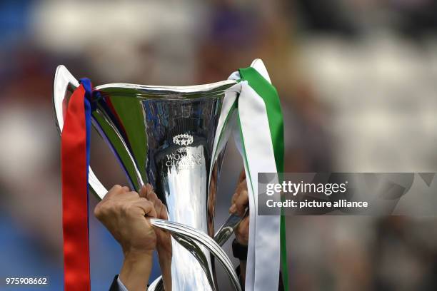 May 2018, Ukraine, Kiev: Women's football, Champions League, VfL Wolfsburg vs Olympique Lyon at the Valeriy Lobanovskyi Dynamo Stadium. A man holding...