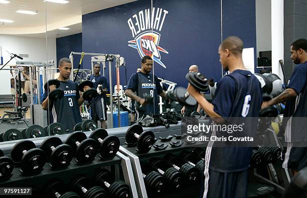 Eric Maynor and Antonio Anderson of the Oklahoma City Thunder lift weights during practice on March 9, 2010 at the Integris Health Thunder Training...