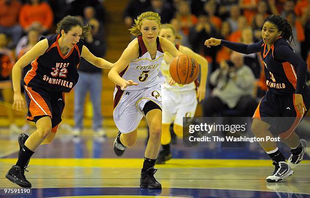 Oakton's Caroline Coyer heads down court with a steal as West Springfield's April Robinson and Mel Todd give chase during Oakton's defeat of West...