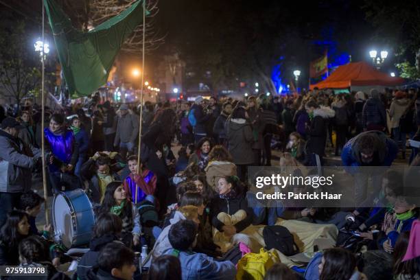 Women sit during a rally to demand legal and free abortion at Congressional Plaza on June 13, 2018 in Buenos Aires, Argentina. A bill to...