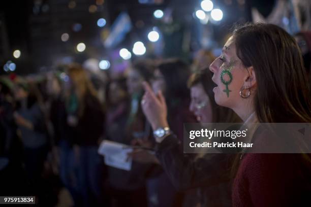 Women chant pro abortion slogans during a rally to demand legal and free abortion at Congressional Plaza on June 13, 2018 in Buenos Aires, Argentina....