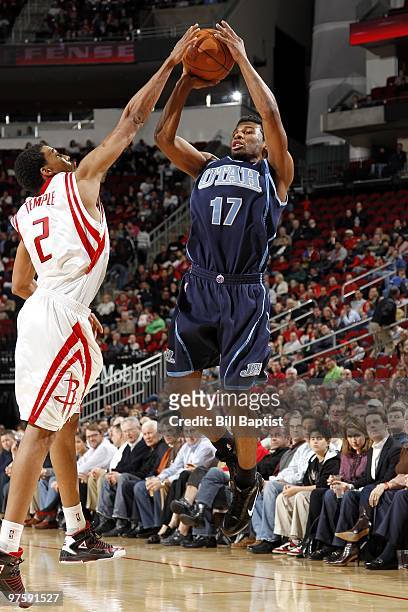 Ronnie Price of the Utah Jazz shoots a jump shot against Garrett Temple of the Houston Rockets during the game at Toyota Center on February 16, 2010...