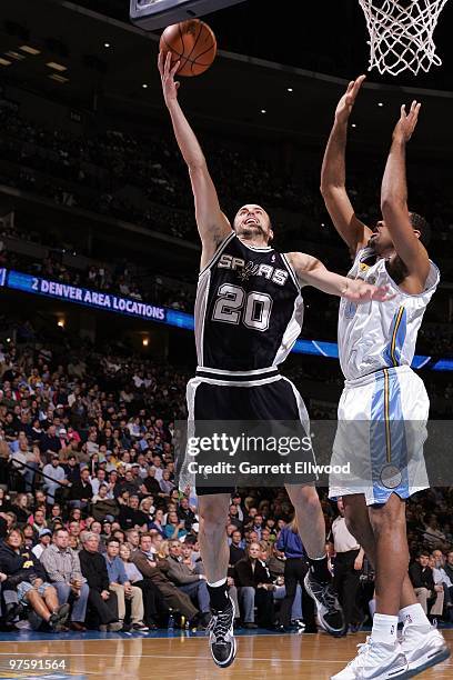 Manu Ginobili of the San Antonio Spurs shoots a layup against Malik Allen of the Denver Nuggets during the game at Pepsi Center on February 11, 2010...