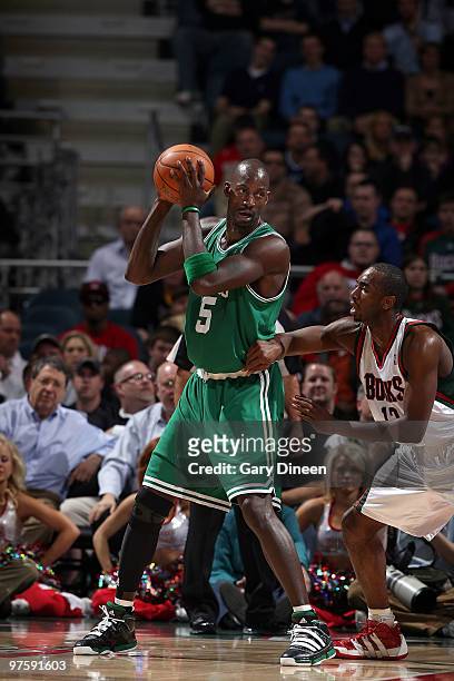 Kevin Garnett of the Boston Celtics posts up against Luc Richard Mbah a Moute of the Milwaukee Bucks on March 9, 2010 at the Bradley Center in...