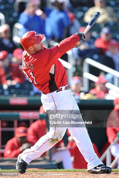 Jonny Gomes of the Cincinnati Reds bats during a Spring Training game against the Arizona Diamondbacks on March 9, 2010 at Goodyear Ballpark in...