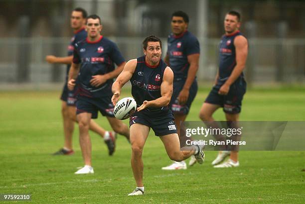Mitchell Pearce of the Roosters passes the ball during a Sydney Roosters NRL training session at Lakeside Oval on March 10, 2010 in Sydney, Australia.