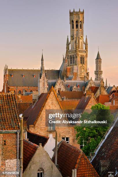 sunset over city and belfry of bruges, belgium - bruges stock pictures, royalty-free photos & images