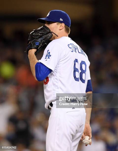 Ross Stripling of the Los Angeles Dodgers reacts after giving up a two run homerun to Pablo Sandoval of the San Francisco Giants during the seventh...