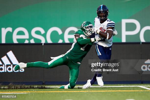 James Wilder Jr. #32 of the Toronto Argonauts fights off Willie Jefferson of the Saskatchewan Roughriders in the game between the Toronto Argonauts...