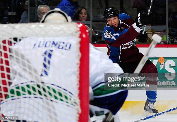 Chris Stewart of the Colorado Avalanche scores a goal against Roberto Luongo of the Vancouver Canucks at the Pepsi Center on March 9, 2010 in Denver,...