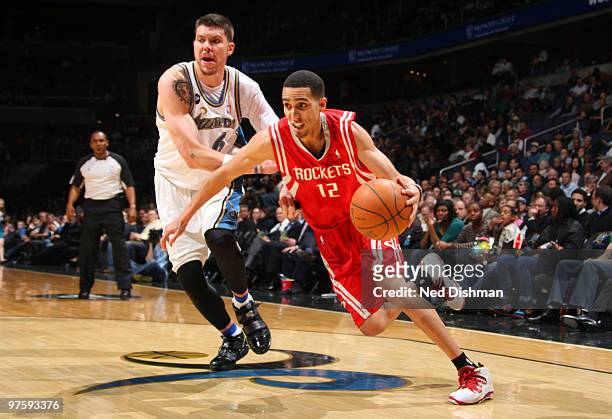 Kevin Martin of the Houston Rockets drives against Mike Miller of the Washington Wizards at the Verizon Center on March 9, 2010 in Washington, DC....