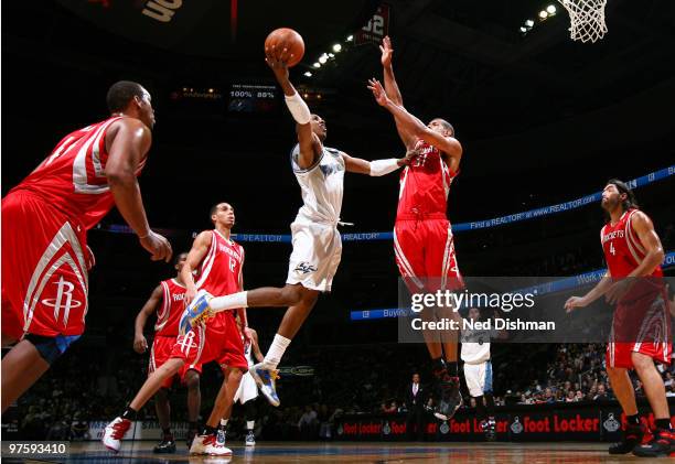 Nick Young of the Washington Wizards shoots against Shane Battier of the Houston Rockets at the Verizon Center on March 9, 2010 in Washington, DC....