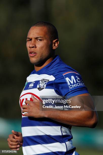Moses Mbye of the Bulldogs looks on during during the warm-up prior to the round 15 NRL match between the Canterbury Bulldogs and the Gold Coast...