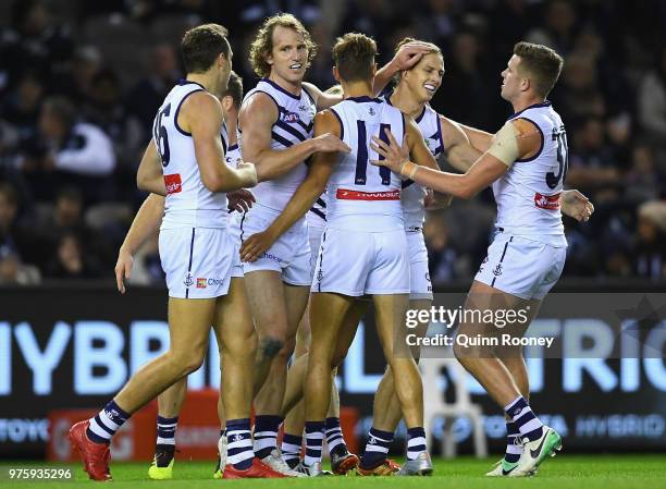 Nat Fyfe of the Dockers is congratulated by team mates after kicking a goal during the round 13 AFL match between the Carlton Blues and the Fremantle...