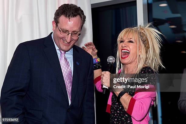 Fashion designer Betsey Johnson and AAPD President and CEO Andrew Imparato laugh at An Evening with Betsey Johnson hosted by the AAPD at the...