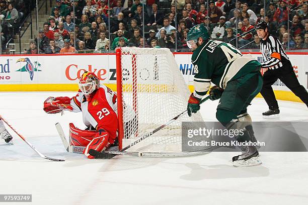 Guillaume Latendresse of the Minnesota Wild attempts to score but is denied by Tomas Vokoun of the Florida Panthers during the game at the Xcel...