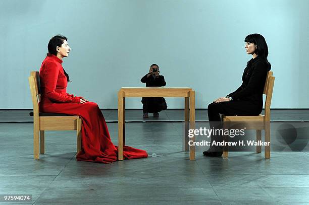 Artist Marina Abramovic performs during the "Marina Abramovic: The Artist is Present" exhibition opening night party at The Museum of Modern Art on...