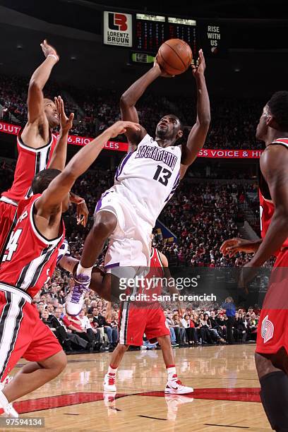 Tyreke Evans of the Sacramento Kings goes up for a shot over Andre Miller of the Portland Trail Blazers during a game on March 9, 2010 at the Rose...