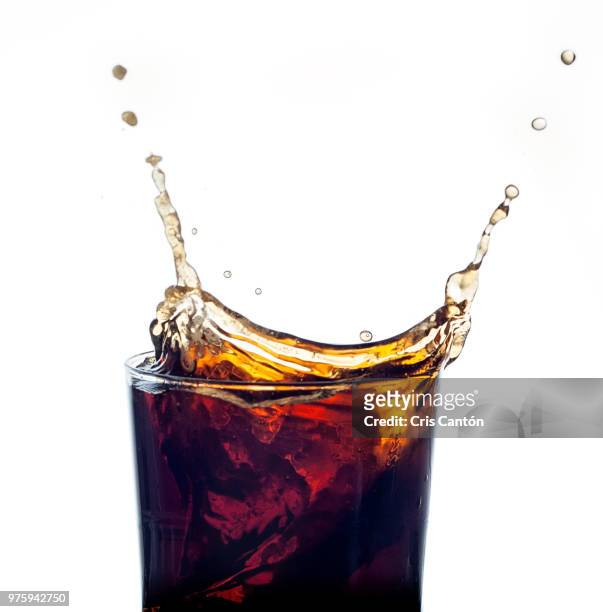 cola splash - splashing cocktail stock pictures, royalty-free photos & images