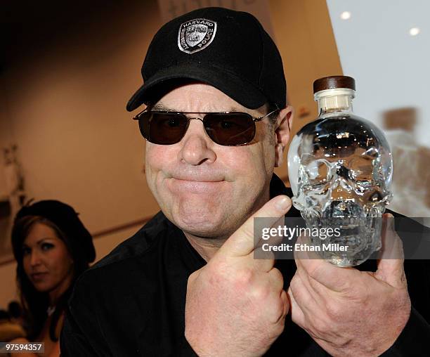 Actor Dan Aykroyd holds a bottle of his Crystal Head Vodka at the Nightclub & Bar Convention and Trade Show at the Las Vegas Convention Center March...